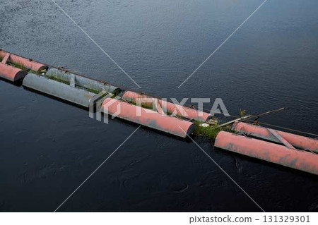 A Floating Barrier Set in a Peaceful and Tranquil Water Landscape Surrounded by Nature 131329301
