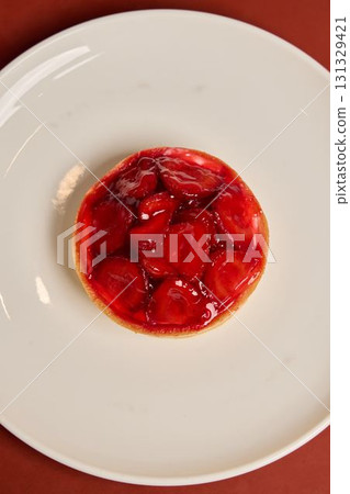 Indulge in a truly delicious and delightful Strawberry Tart topped with a shiny glaze Indulge in a truly delicious and delightful Strawberry Tart topped with a shiny glaze 131329421
