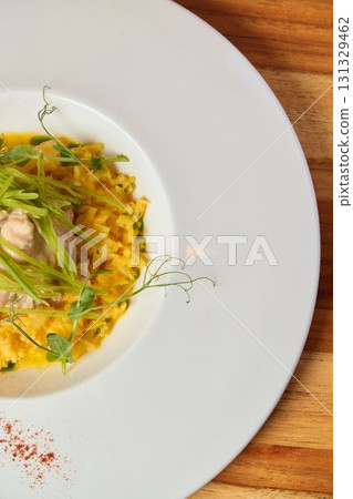 A Delicious and Flavorful Pasta Dish Beautifully Garnished with Fresh Green Herbs A Delicious and Flavorful Pasta Dish Beautifully Garnished with Fresh Green Herbs 131329462