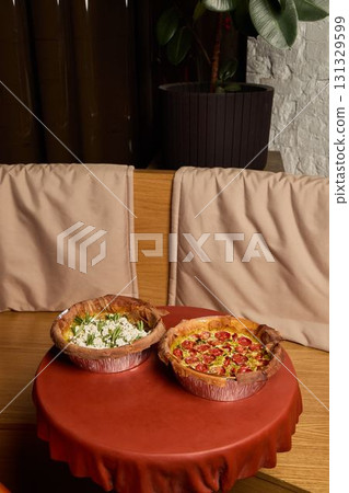 Enjoying Delicious Homemade Pies Beautifully Presented on a Rustic Wooden Table Setting 131329599