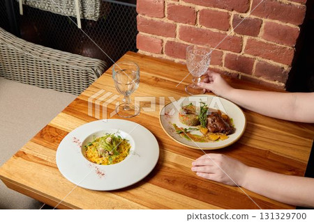 Enjoy a truly delicious culinary experience at a cozy and inviting restaurant atmosphere 131329700