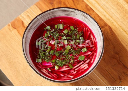 Enjoy a deliciously vibrant Beetroot Soup, made with fresh herbs and colorful vegetables 131329714