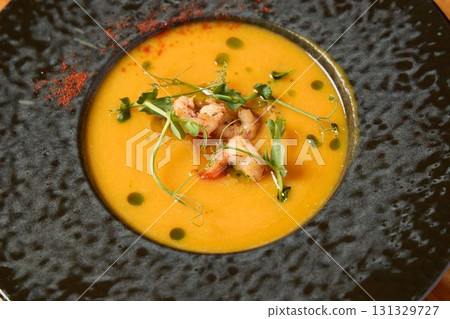 Gourmet Creamy Soup, featuring succulent Shrimp and vibrant Microgreens for a delicious delight Gourmet Creamy Soup, featuring succulent Shrimp and vibrant Microgreens for a delicious delight 131329727