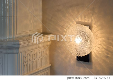 This stunning wall sconce casts beautifully intricate light patterns that captivate everyone This stunning wall sconce casts beautifully intricate light patterns that captivate everyone 131329744