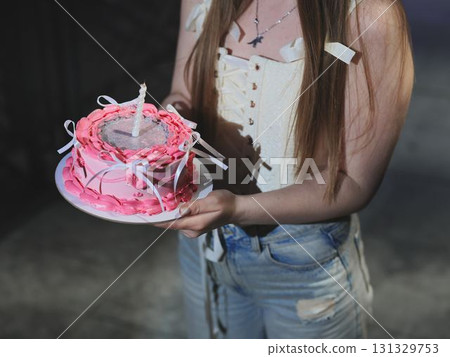 A Sweet and Joyful Celebration Featuring a Beautiful Pink Birthday Cake for Everyone A Sweet and Joyful Celebration Featuring a Beautiful Pink Birthday Cake for Everyone 131329753