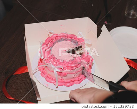 Delicious and Beautiful Pink Birthday Cake Being Served at a Joyous Celebration Event Delicious and Beautiful Pink Birthday Cake Being Served at a Joyous Celebration Event 131329758