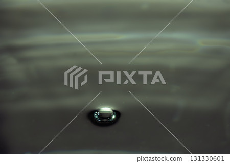 187.Single Water Droplet on Dark Reflective Surface 187.Single Water Droplet on Dark Reflective Surface 131330601