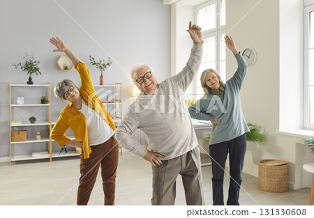Sporty senior people exercising, doing fitness for health care of elderly people in geriatric club Sporty senior people exercising, doing fitness for health care of elderly people in geriatric club 131330608