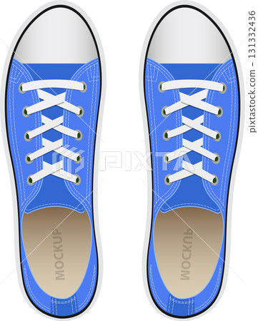 Two blue canvas sneakers with white laces are viewed from above on a black background. Two blue canvas sneakers with white laces are viewed from above on a black background. 131332436