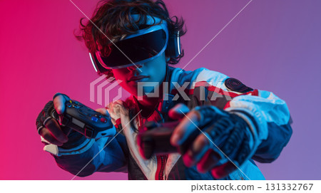 Teen immersed in virtual gaming with haptic gloves and vibrant lighting 131332767