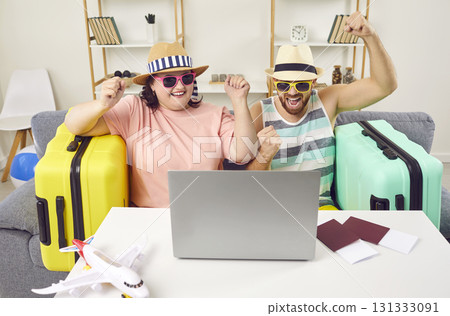 Happy family couple using laptop and booking holiday tour with cool travel destination 131333091