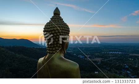 Aerial view of the Golden big Buddha Statue at Sunset. Aerial view of the Golden big Buddha Statue at Sunset. 131333723