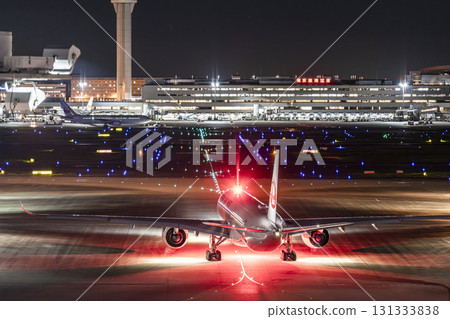 Haneda Airport at night, airplane taxiing, Ota Ward, Tokyo 131333838