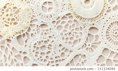 Lace textile background featuring intricate floral patterns, perfect for creative design projects Lace textile background featuring intricate floral patterns, perfect for creative design projects 131334094