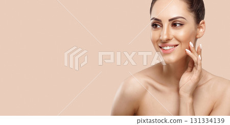 Beauty Woman Cosmetics. Portrait of female perfect clean skin. Care healthy skin. Facial treatment. Panorama baner With Copy Space. Beauty Woman Cosmetics. Portrait of female perfect clean skin. Care healthy skin. Facial treatment. Panorama baner With Copy Space. 131334139