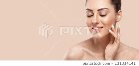Beautiful young woman with clean perfect skin. Portrait of beauty model with natural nude make up and touching her face. Panorama, baner With Copy Space Beautiful young woman with clean perfect skin. Portrait of beauty model with natural nude make up and touching her face. Panorama, baner With Copy Space 131334141