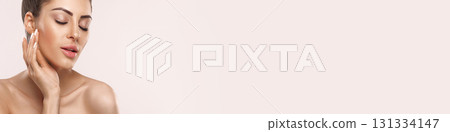 Skin Care. Woman With Beauty Face Touching Healthy Facial Skin Portrait. Beautiful Smiling Girl Model With Natural Makeup Touching Her Ski 131334147