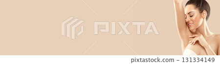 Woman Holding Her Arms Up And Showing Clean Underarms. Armpit Epilation, Laser Hair Removal.  Depilation  Smooth Clear Skin 131334149