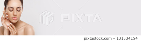 Portrait Of A Woman With A Beautiful Face And Perfect Skin. Skin Care. Cosmetology, Beauty And Spa. Panorama 131334154