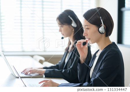 Women working in a call center Women working in a call center 131334447