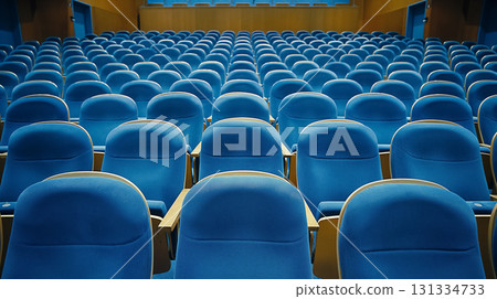 Empty blue seats in an auditorium. 131334733