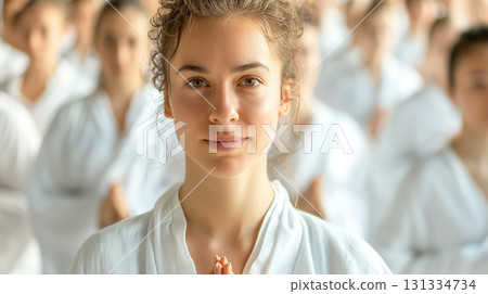 Young woman in karate uniform. 131334734