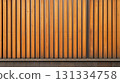 Warm-toned wooden slats on a wall. 131334758