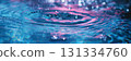 Water ripple with pink and blue hues. 131334760