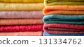 Pile of colorful folded fabrics. 131334762