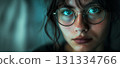 Woman with striking blue eyes and glasses. 131334766
