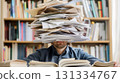 Man overwhelmed by a stack of papers. 131334767