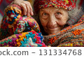 Elderly woman in a multitude of colorful, knitted garments. 131334768