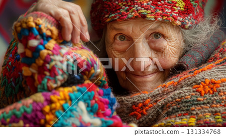 Elderly woman in a multitude of colorful, knitted garments. 131334768
