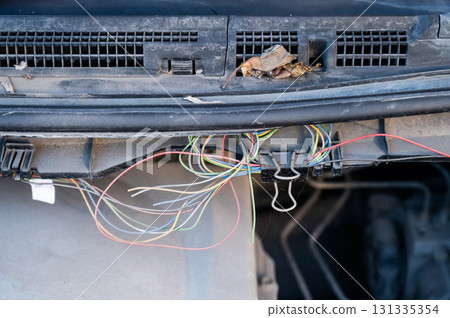 Electrical fault in car. Wires sticking out. Electrical fault in car. Wires sticking out. 131335354