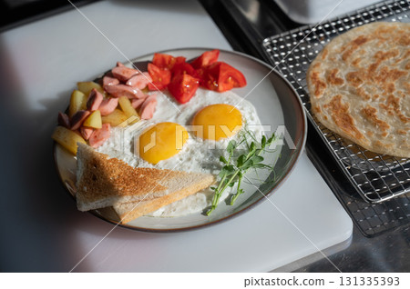 Fried eggs served in a cafe.  131335393