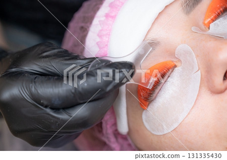 Caucasian woman undergoing eyelash lamination procedure.  131335430