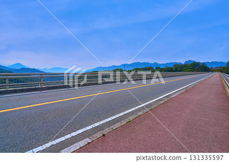 Autumn view of Mount Fuji and the Southern Alps from the top of the Yatsugatake Kogen Ohashi Bridge (yellow bridge) in Hokuto City, Yamanashi Prefecture 131335597
