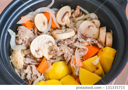 Add mushrooms to the pan and fry 131335715