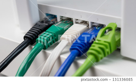 Colorful Ethernet Cables Connected to a Router. Colorful Ethernet Cables Connected to a Router. 131336085