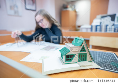 Caucasian young woman making drawings. Student of architecture university.  131336233