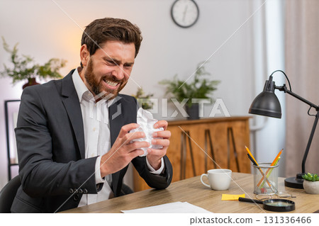 Middle-aged businessman manager crushes faulty report exhales hard calms and returns to edit again Middle-aged businessman manager crushes faulty report exhales hard calms and returns to edit again 131336466