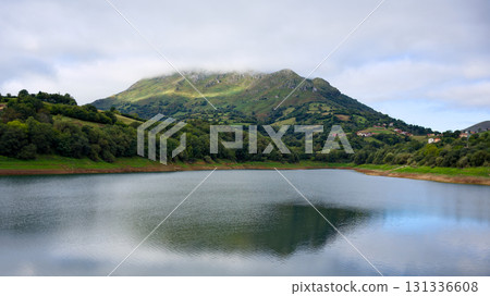 Scenic mountain lake with reflection in calm water 131336608