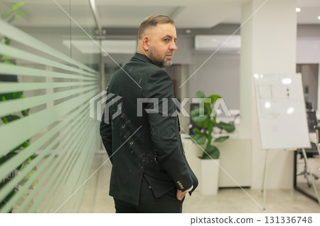 Caucasian man in dirty jacket in office. Caucasian man in dirty jacket in office. 131336748