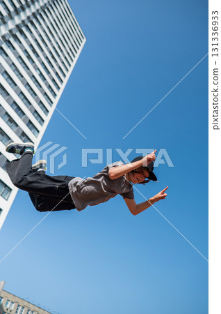 A girl jumps on a gymnastic trampoline. 131336933