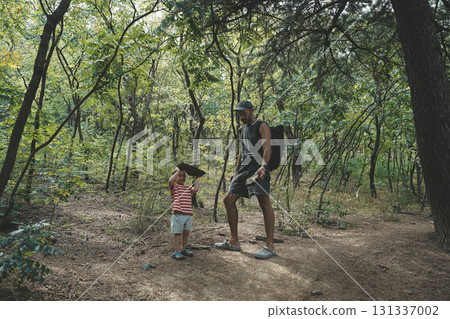 Father and Toddler Spending Time in Summer Forest Father and Toddler Spending Time in Summer Forest 131337002
