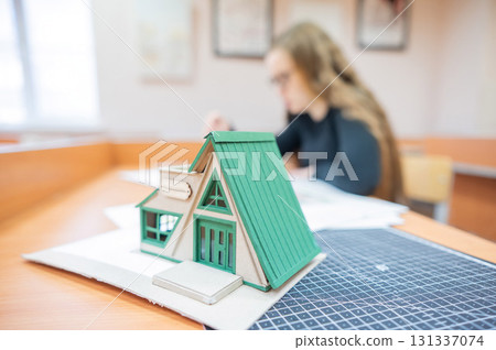 Caucasian young woman making drawings. Student of architecture university.  131337074