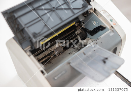 Broken laser printer cartridge on white background. Broken laser printer cartridge on white background. 131337075