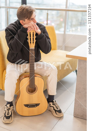 Caucasian man holding acoustic guitar. Caucasian man holding acoustic guitar. 131337194