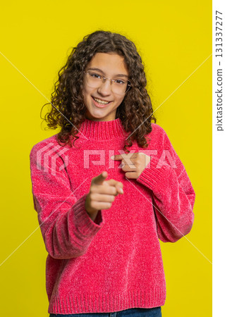 Smiling happy girl pointing forward to camera, choosing lucky victory winner, indicating, promotion 131337277
