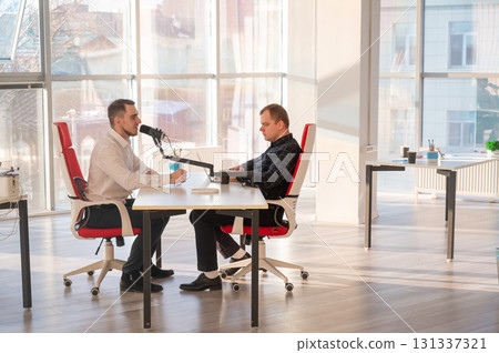 Two Caucasians Recording an Audio Podcast.  131337321